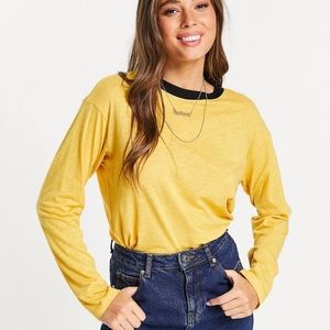 MONKL yellow/mustard long sleeve shirt with circular neck and black outline. Med